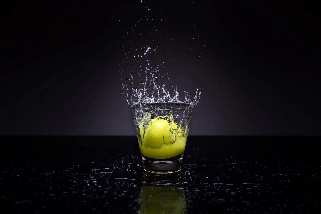 A cocktail being finished at the bar