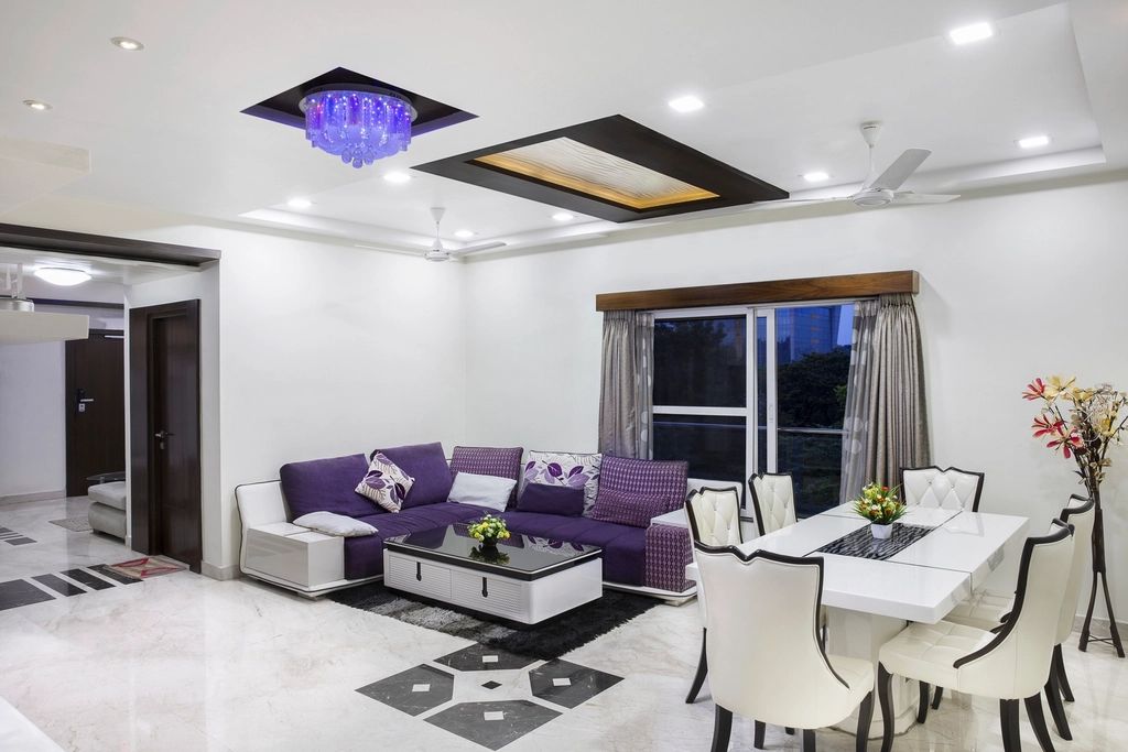 A suite sitting room with a sofa and armchairs